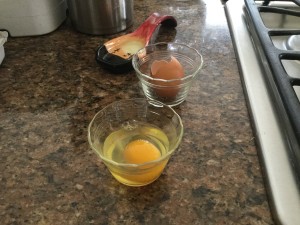 Crack the egg into a small bowl.